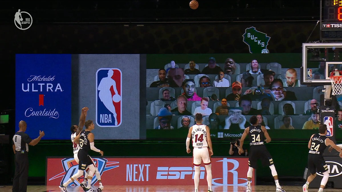 More audience members from the back of the court